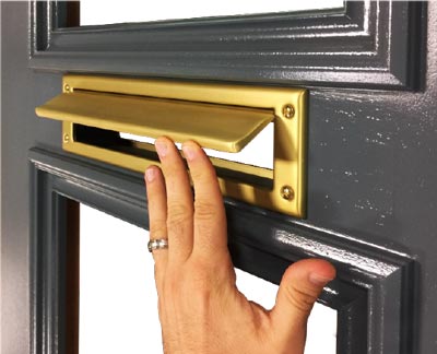 brass mail slot routed into door